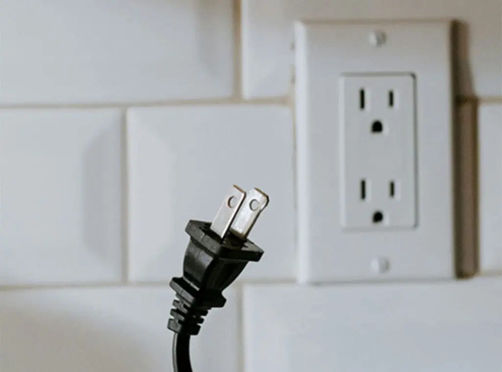 plug and electrical outlet as a metaphor for letting go